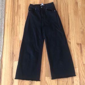 Black wide legged sailor pants with raw hem